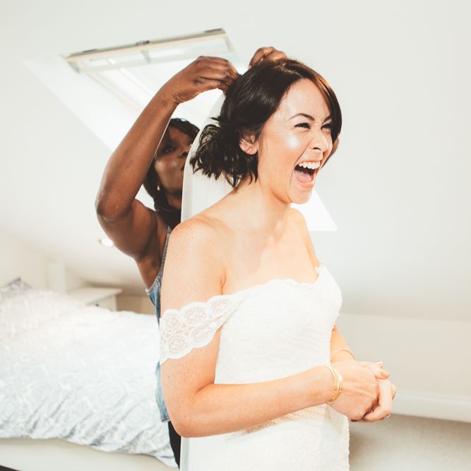Bride Having Hair Done On Wedding Morning