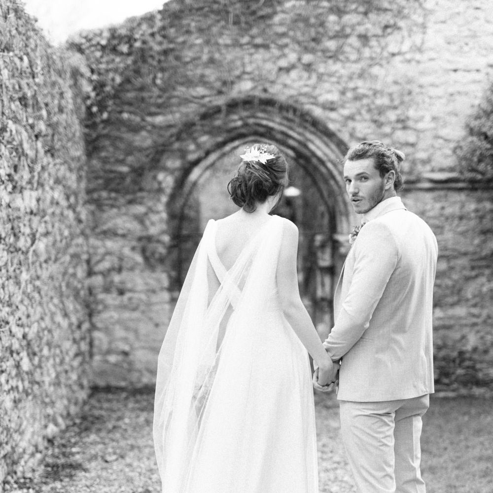 Bride in Cherry Williams Gown | Groom in Beige Suit | Romantic Blush Wedding Inspiration by The Wedding Stylist at Notley Abbey with Joanna Truby Flowers | Emma Pilkington Photography | Opaline Films