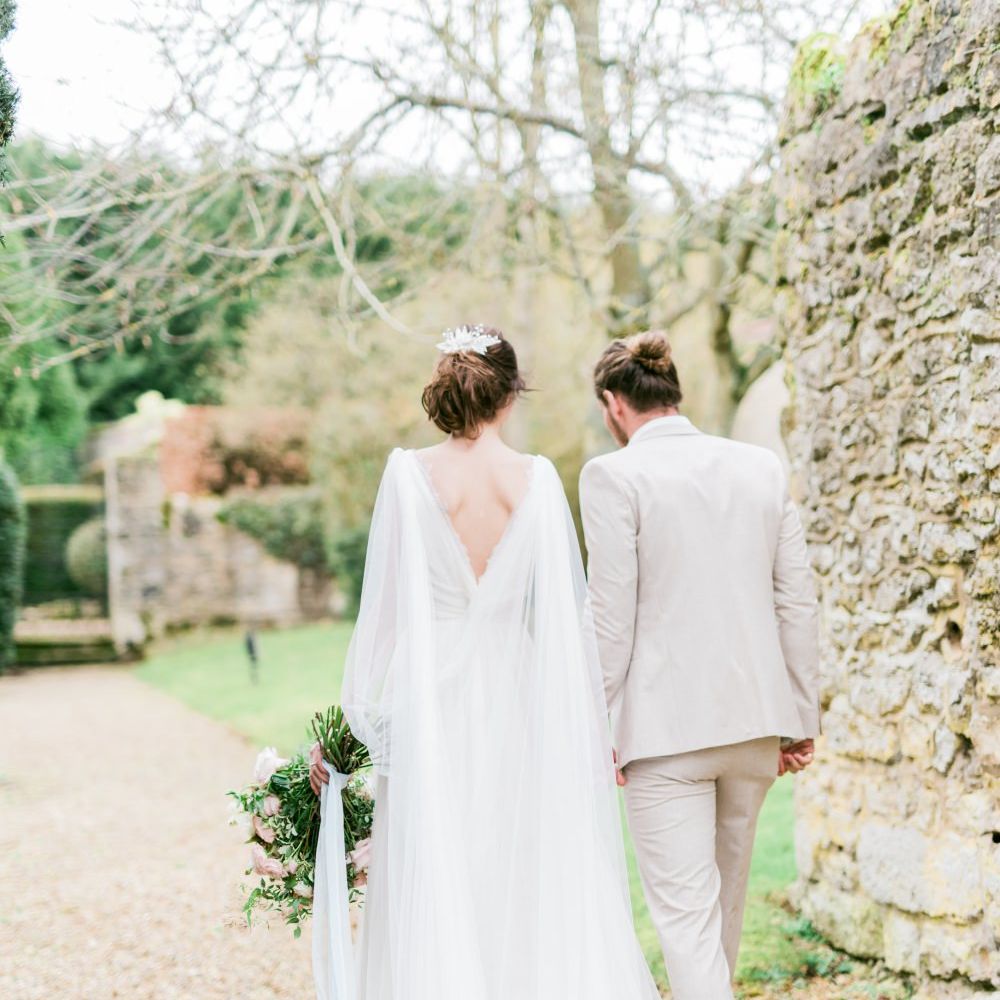 Bride in Cherry Williams Gown | Groom in Beige Suit | Romantic Blush Wedding Inspiration by The Wedding Stylist at Notley Abbey with Joanna Truby Flowers | Emma Pilkington Photography | Opaline Films