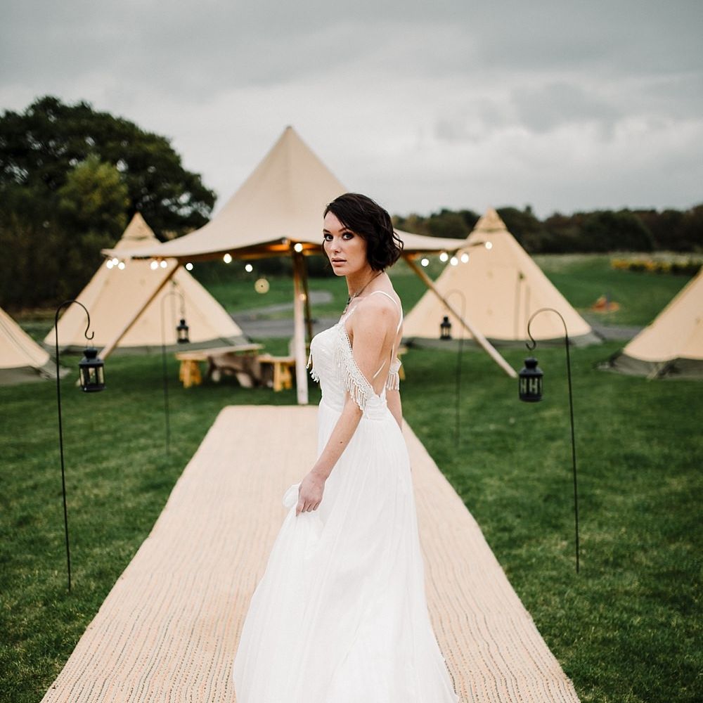 Tipi by All About Me Marquees | Boho Bride in Shikoba Bride Wedding Dress | Boho Winter Tipi Wedding Inspiration | Styling & Concept by Pretty Creative | Amy Faith PhotographyBoho Winter Tipi Wedding Pretty Creative Amy Faith Photography_0121_0