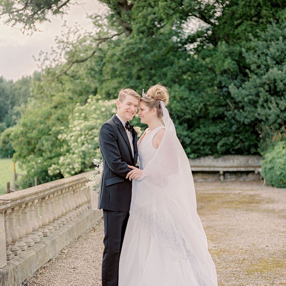 Bride in Dee Hutton Wedding Dress | Groom in Black Tuxedo | Classic Blue & White Wedding at Prestwold Hall in Loughborough | Georgina Harrison Photography