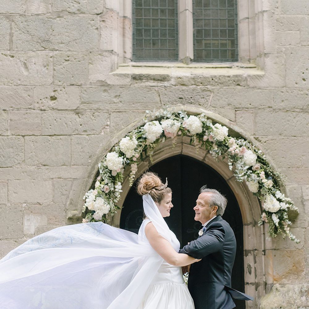 Bridal Entrance | Floral Arch | Classic Blue & White Wedding at Prestwold Hall in Loughborough | Georgina Harrison Photography