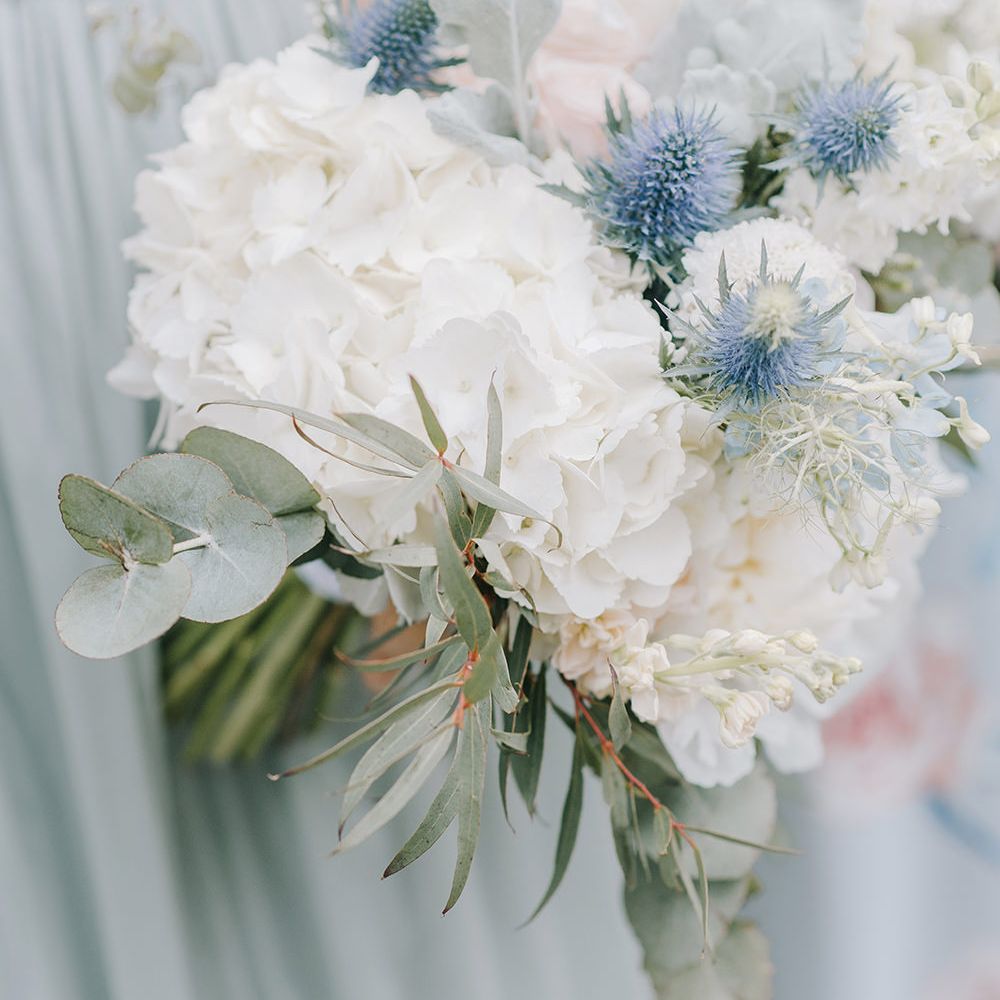 White Hydrangea & Thistle Bouquet | Classic Blue & White Wedding at Prestwold Hall in Loughborough | Georgina Harrison Photography