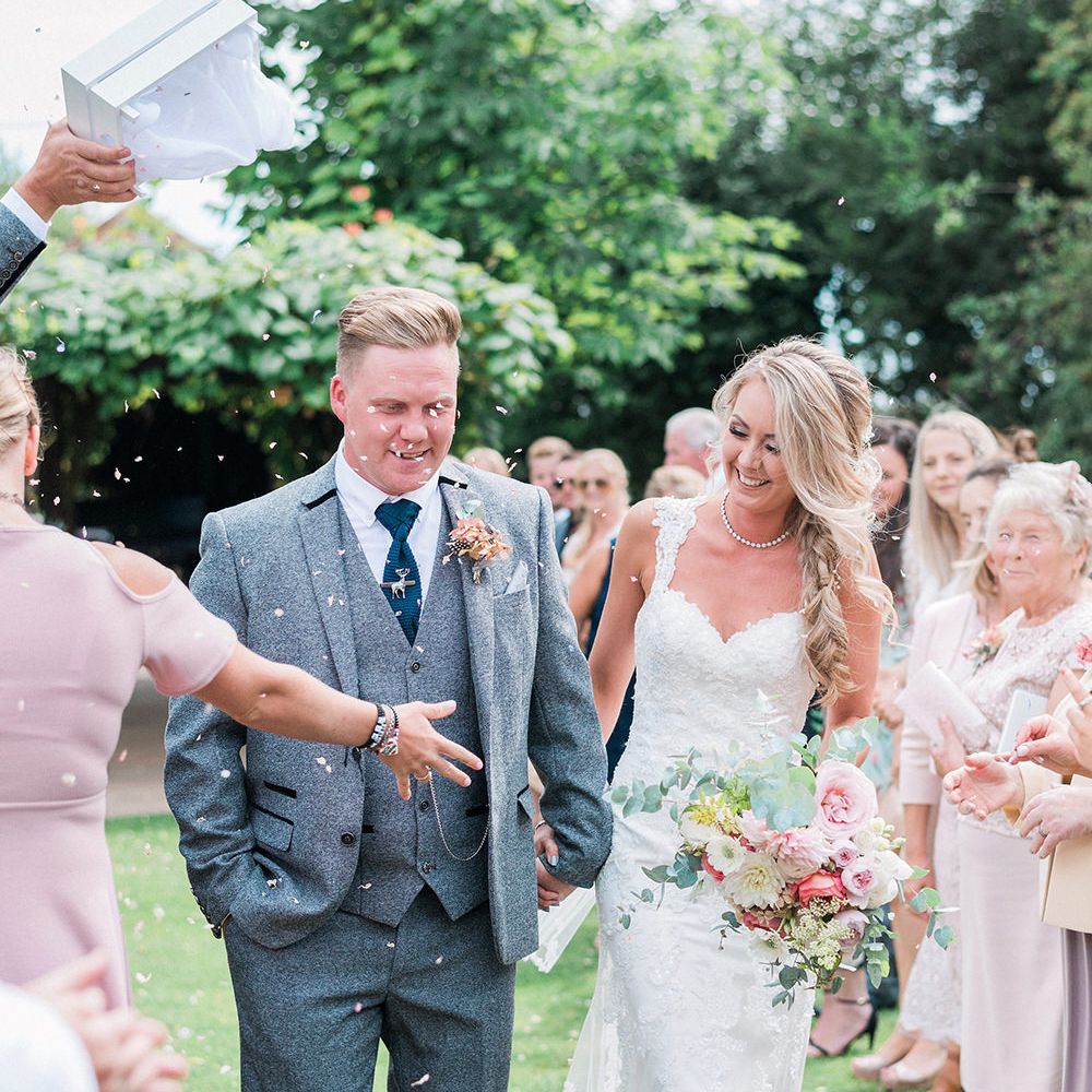 Confetti Moment | Bride in Lace Enzoani 'Inaru' Bridal Gown | Groom in Grey Wool Master Debonair Suit | Pink & Coral Country Wedding at Crabbs Barn, Essex | Kathryn Hopkins Photography | Film by Colbridge Media Services Ltd