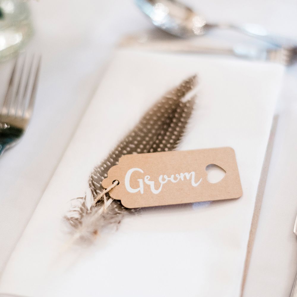 Kraft Place Name Tag & Feather Wedding Decor | Romantic Peach & Coral Floral Centrepiece | Peach & Coral Country Wedding at Crabbs Barn, Essex | Kathryn Hopkins Photography | Film by Colbridge Media Services Ltd