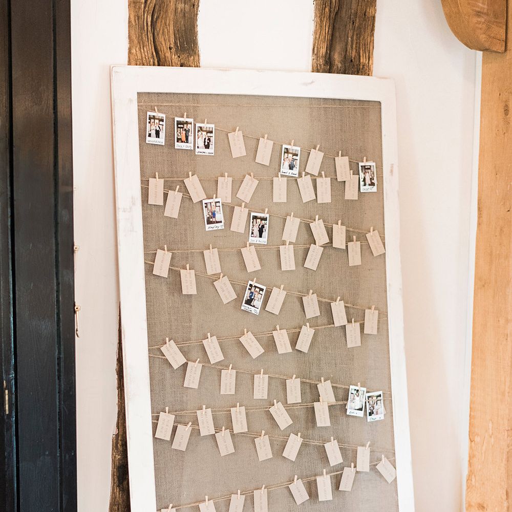 Escort Card Seating Chart with Tags & Polaroid Pictures | Romantic Peach & Coral Floral Centrepiece | Peach & Coral Country Wedding at Crabbs Barn, Essex | Kathryn Hopkins Photography | Film by Colbridge Media Services Ltd
