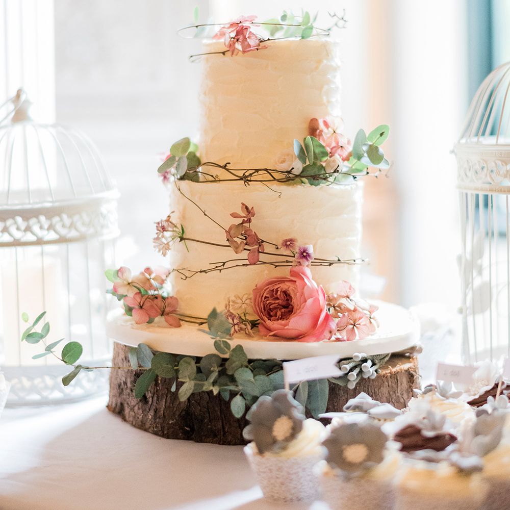 Iced Wedding Cake & Coral Decor on Tree Stump Cake Stand | Romantic Peach & Coral Floral Centrepiece | Peach & Coral Country Wedding at Crabbs Barn, Essex | Kathryn Hopkins Photography | Film by Colbridge Media Services Ltd