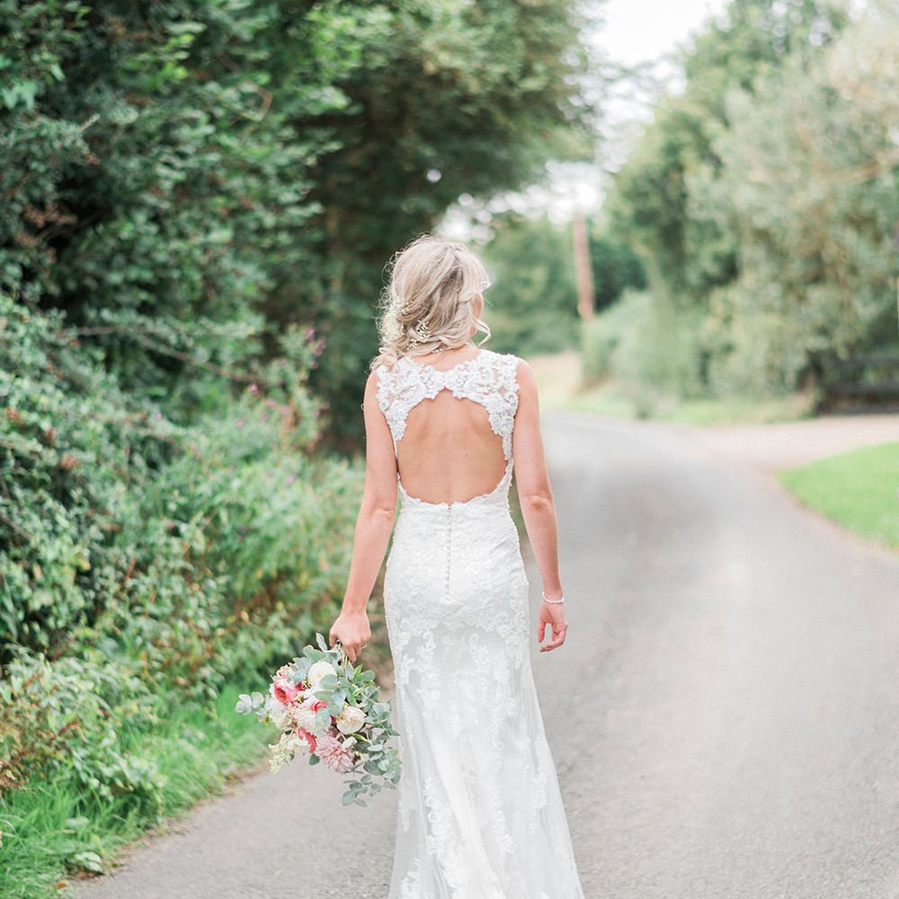 Bride in Lace Enzoani 'Inaru' Bridal Gown with Keyhole Back | Romantic Pink & Coral Bouquet with Roses & Dahlias | Peach & Coral Country Wedding at Crabbs Barn, Essex | Kathryn Hopkins Photography | Film by Colbridge Media Services Ltd