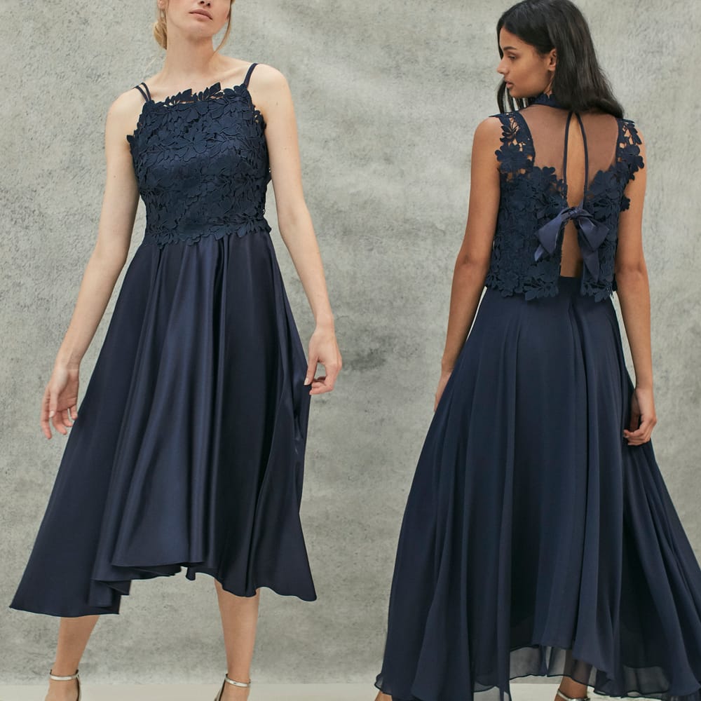 <a href="https://www.coast stores.com/p/janie lace midi dress/1875120?utm_source=Rock_my_wedding&utm_medium=social&utm_campaign=blog_post&utm_content=janie2" rel="noopener" target="_blank">Jani Lace Midi Dress</a> by Coast