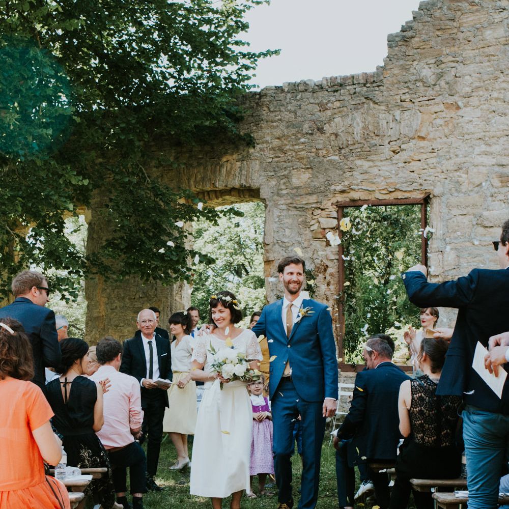 Boho Bride in Bespoke Lace Bridal Separates | Groom in Blue Suit | Chic Rustic French Wedding at Le Morimont Styled by Féelicité | Photography by Chloe