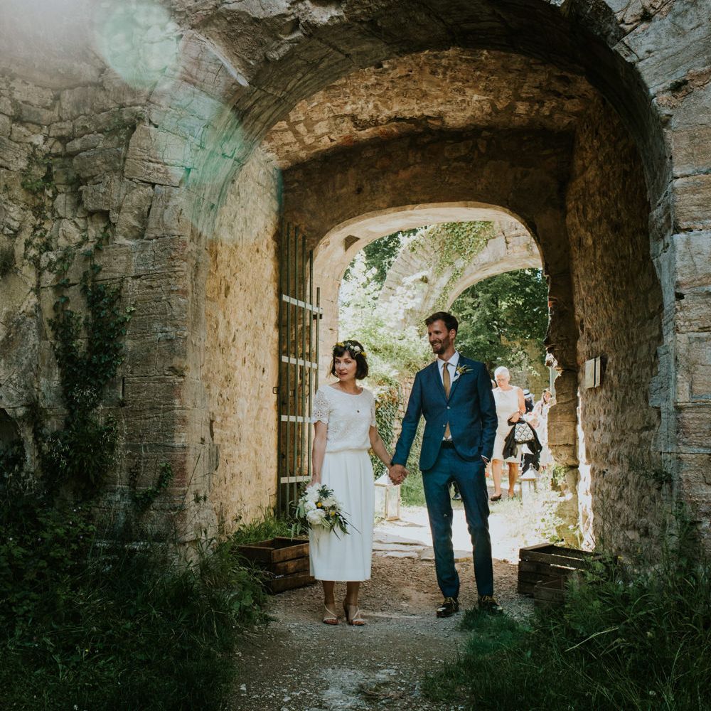 Boho Bride in Bespoke Lace Bridal Separates | Groom in Blue Suit | Chic Rustic French Wedding at Le Morimont Styled by Féelicité | Photography by Chloe