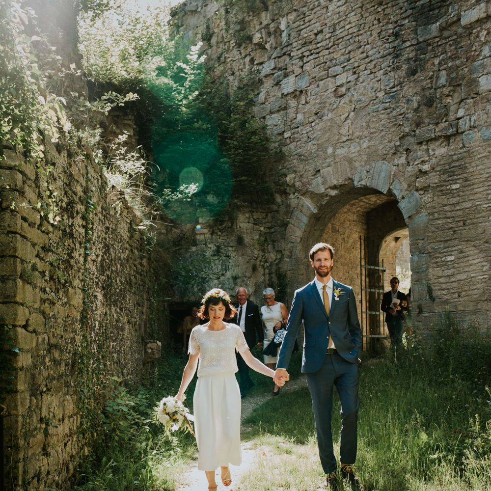 Boho Bride in Bespoke Lace Bridal Separates | Groom in Blue Suit | Chic Rustic French Wedding at Le Morimont Styled by Féelicité | Photography by Chloe