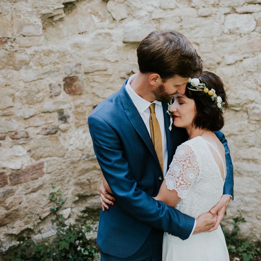 Boho Bride in Bespoke Lace Bridal Separates | Groom in Blue Suit | Chic Rustic French Wedding at Le Morimont Styled by Féelicité | Photography by Chloe