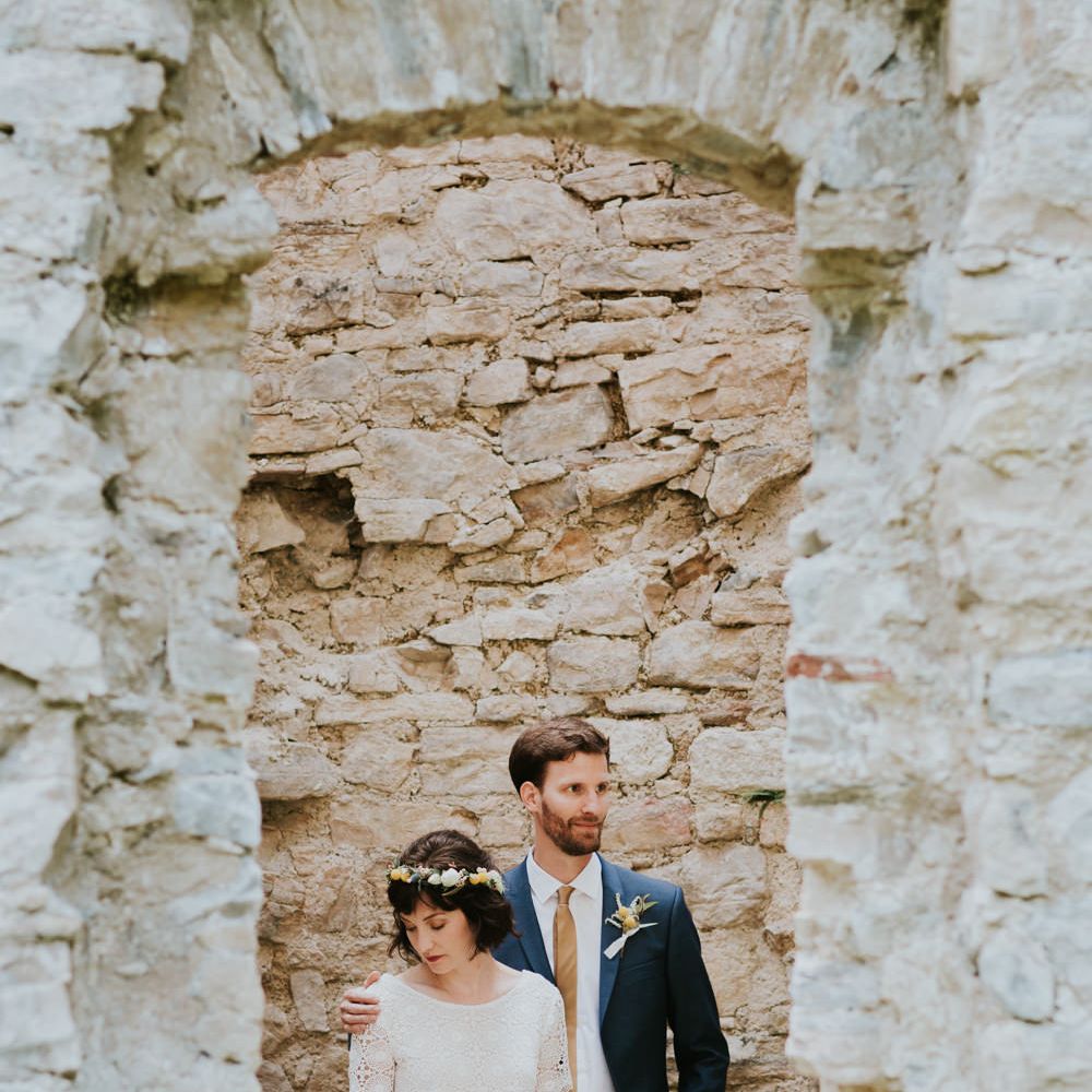 Boho Bride in Bespoke Lace Bridal Separates | Groom in Blue Suit | Chic Rustic French Wedding at Le Morimont Styled by Féelicité | Photography by Chloe