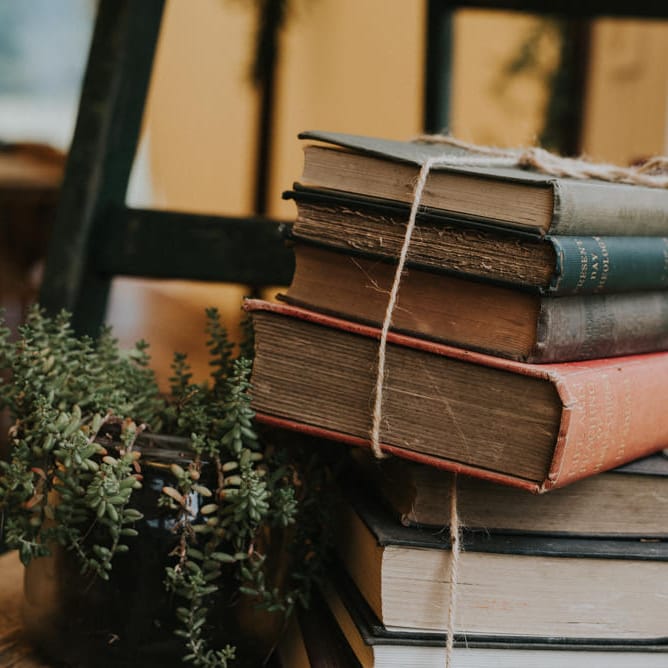 Vintage Books Wedding Decor | Outdoor Woodland Wedding at The Dreys in Kent | Fern Edwards Photography