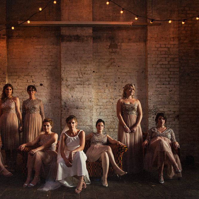 Warm & moody group shot of bride and bridesmaids