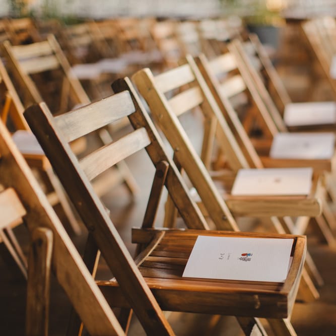 Warehouse Wedding With Wooden Chairs & Foliage Installation | Images by Frances Sales