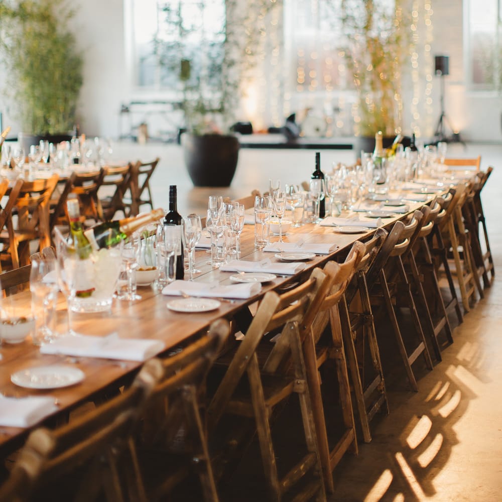 Warehouse Wedding With Wooden Chairs & Foliage Installation | Images by Frances Sales