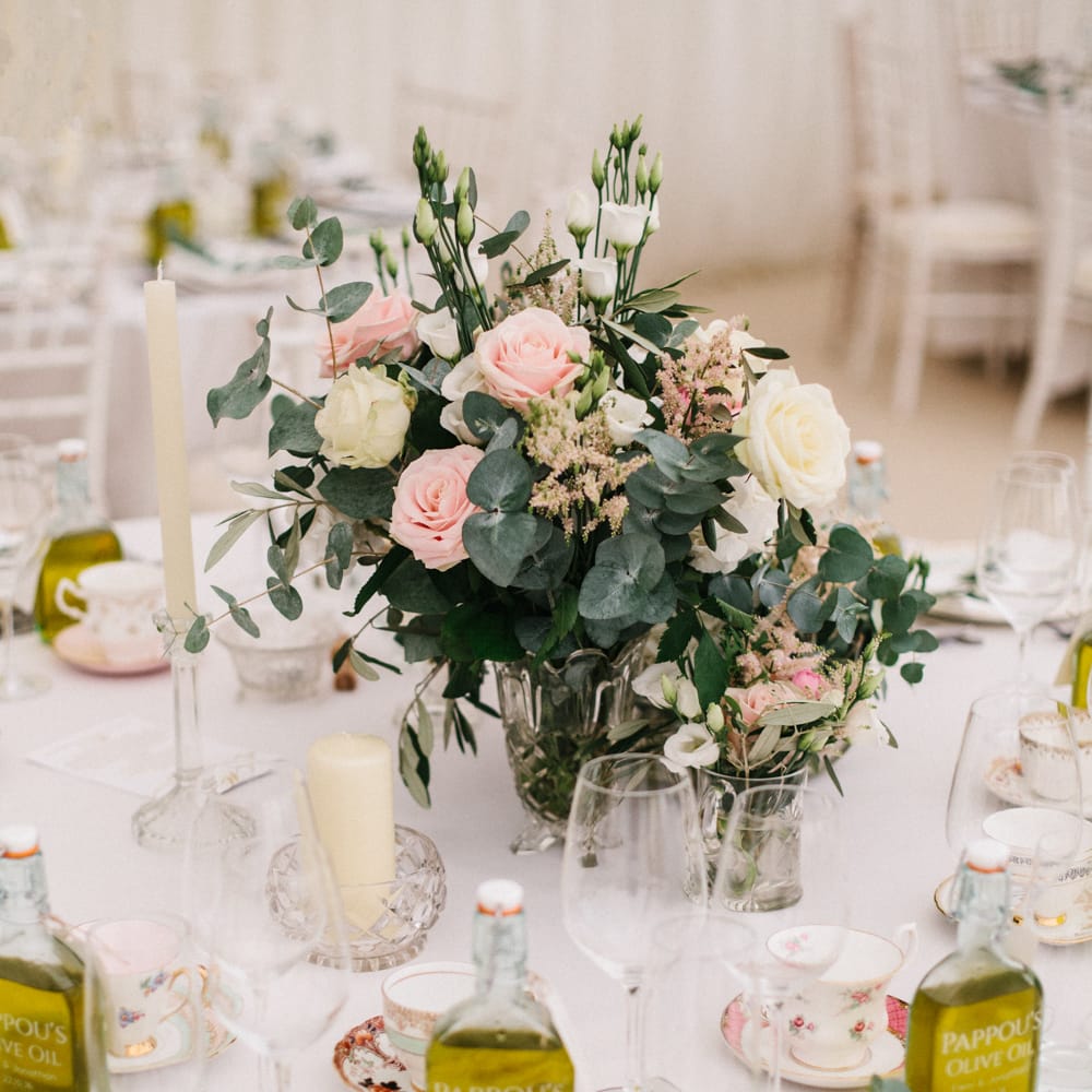 Elegant Table Settings With Pink Roses For A Marquee Wedding