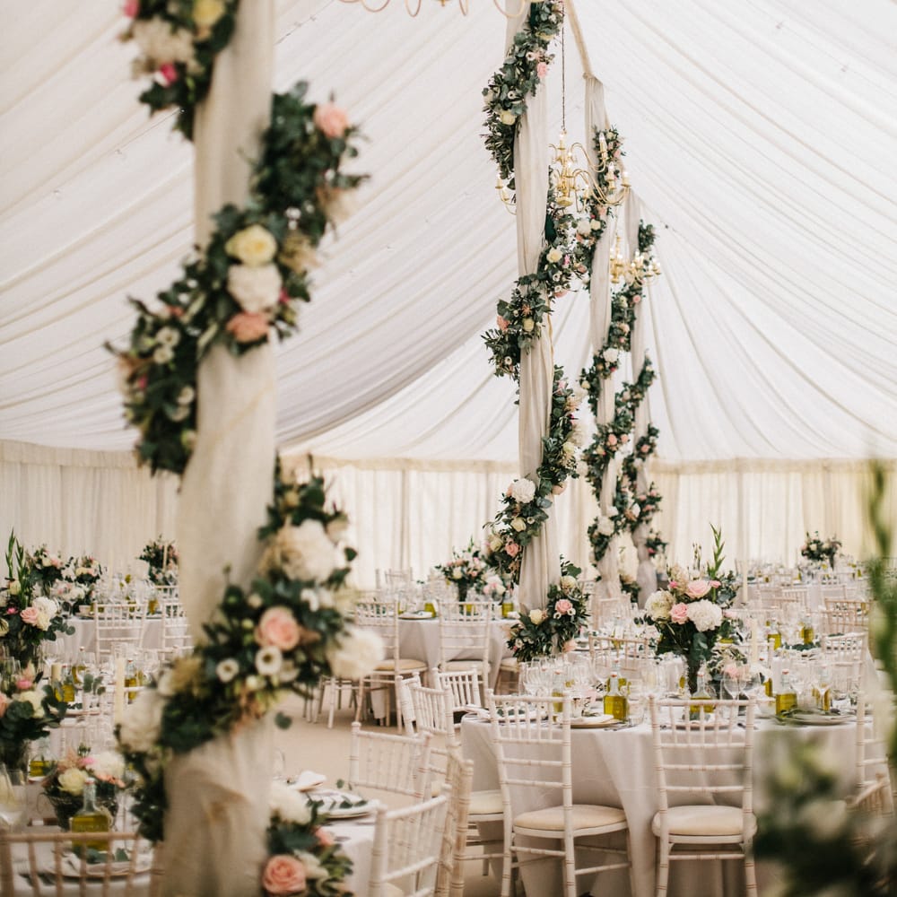 Marquee Poles With Floral Decor