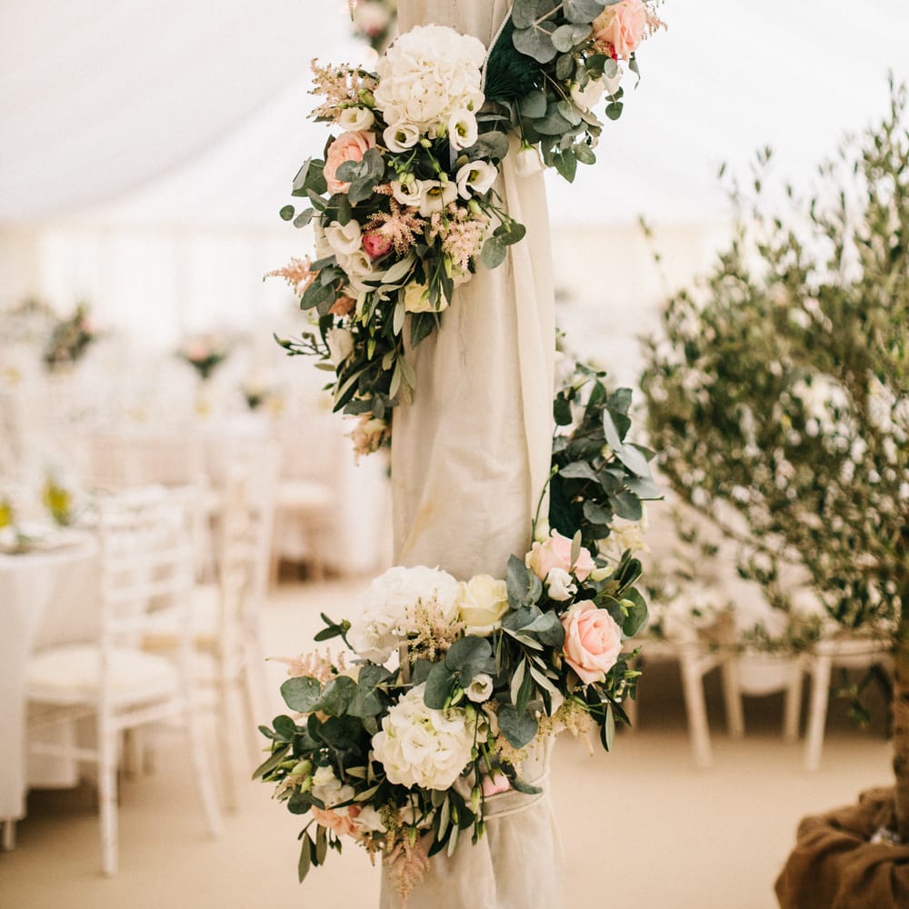 Marquee Poles With Floral Decor