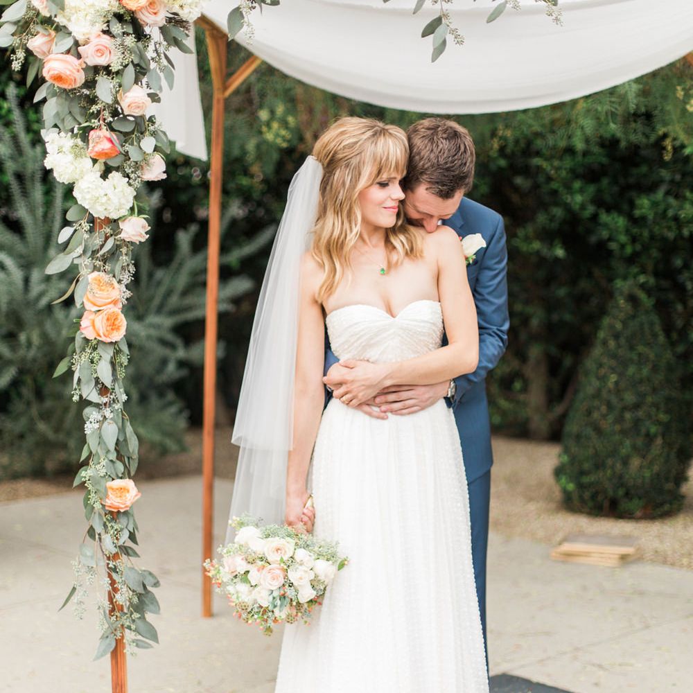 Bride & Groom Portrait Under a Floral Arch