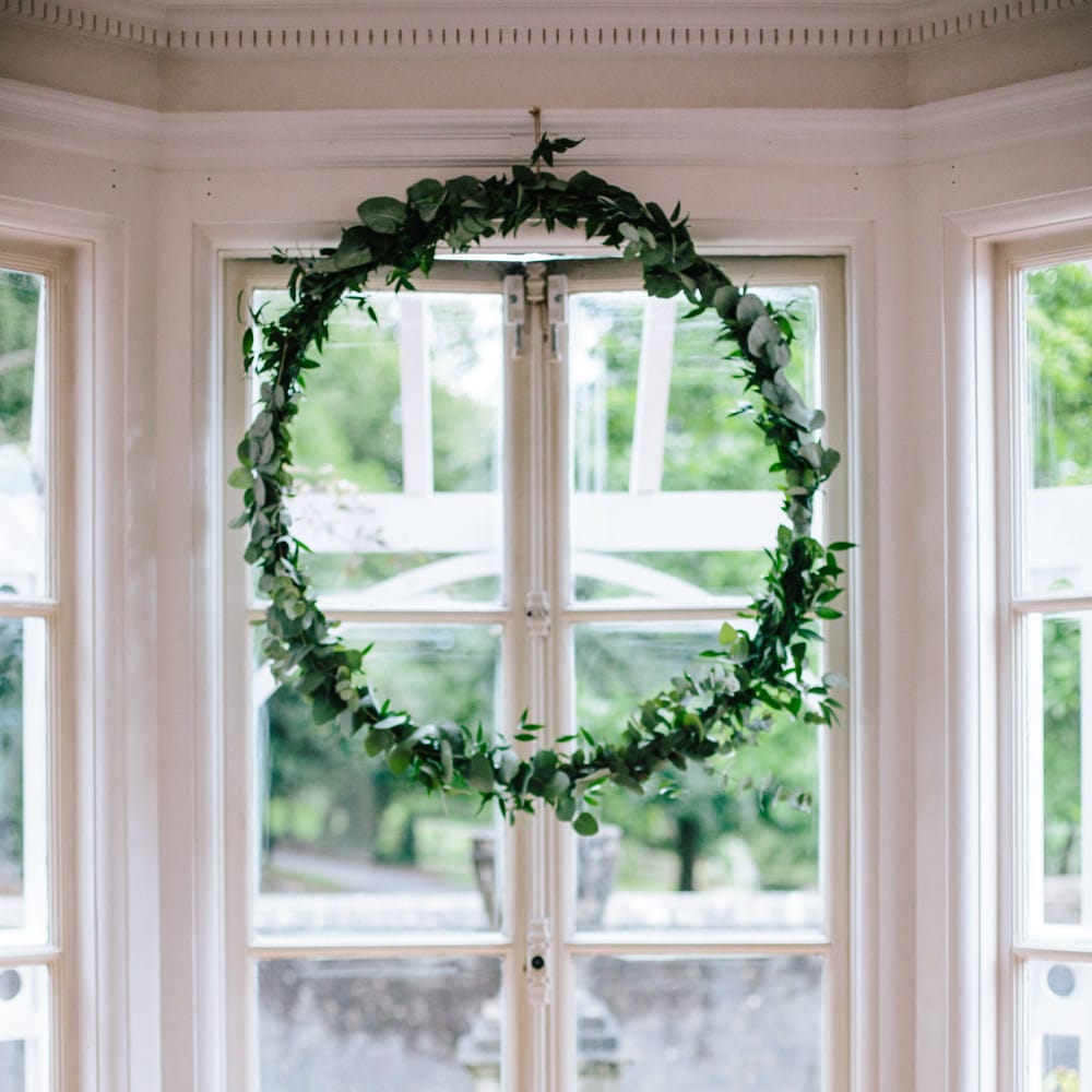 Greenery Hoop & Flower Stems in Jars Wedding Decor | Colourful DIY Wedding at Barley Wood Country House in Somerset | A Thing Like That Photography