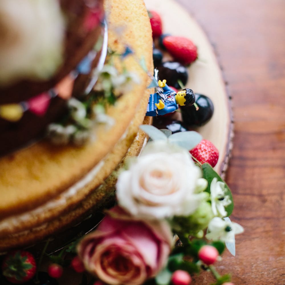 Naked Cake with Flower, Fruit & Lego Decor | Colourful DIY Wedding at Barley Wood Country House in Somerset | A Thing Like That Photography