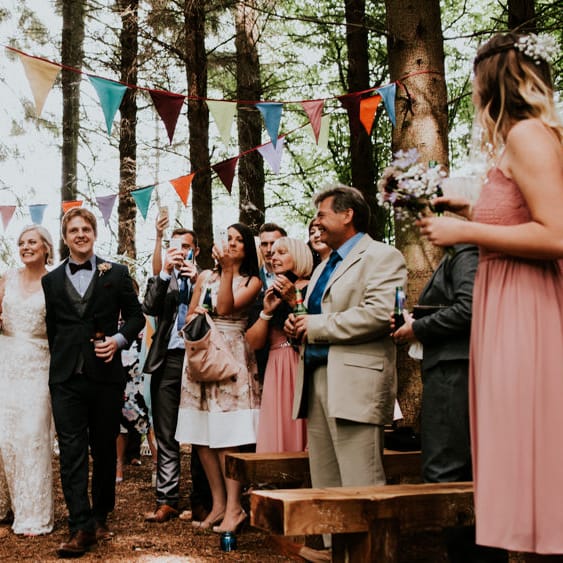 Woodland Wedding Ceremony | Bride in Catherine Deane Gown | Groom in Ben Sherman Suit, Bow Tie & Gingham Shirt | Colourful Outdoor Wedding at Lineham Farm in Leeds | Shutter Go Click Photography