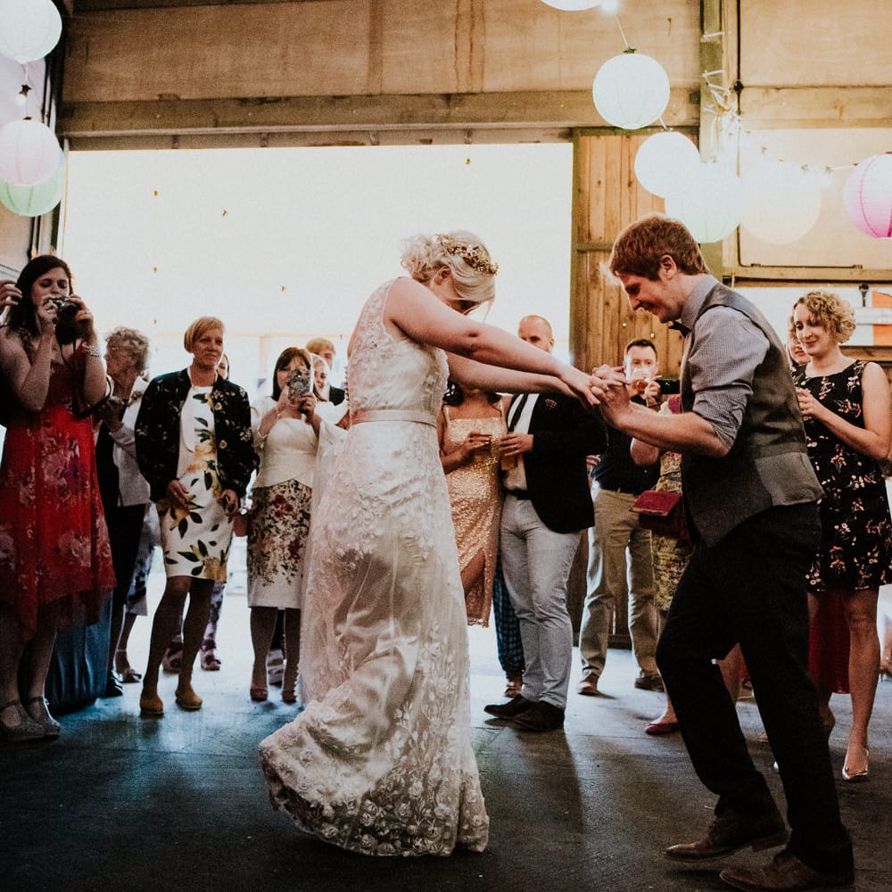 First Dance | Bride in Catherine Deane Gown | Groom in Ben Sherman Suit, Bow Tie & Gingham Shirt | Colourful Barn Reception at Lineham Farm in Leeds | Shutter Go Click Photography