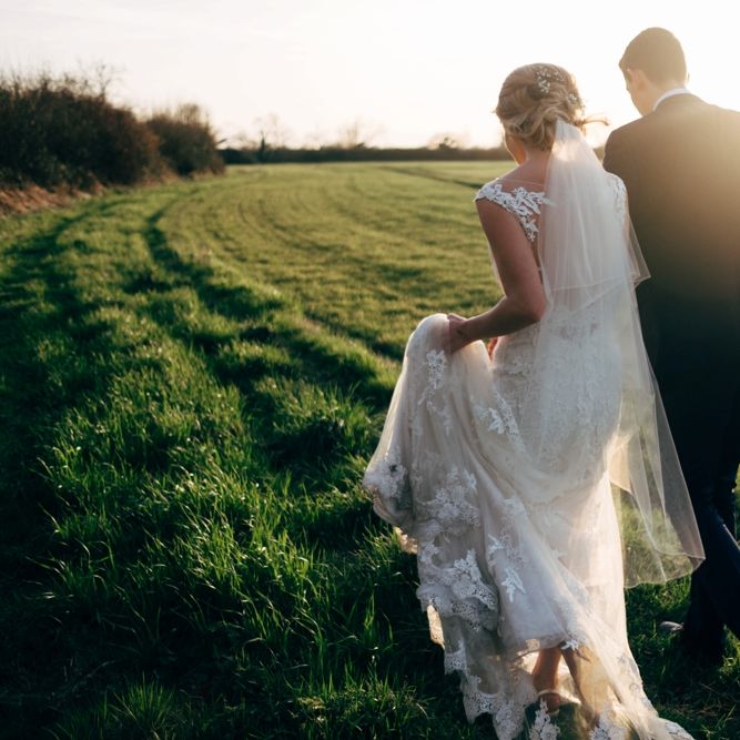 Bride in Lace Illusion Neck Wedding Dress | Groom in Next Suit | Dale Weeks Photography