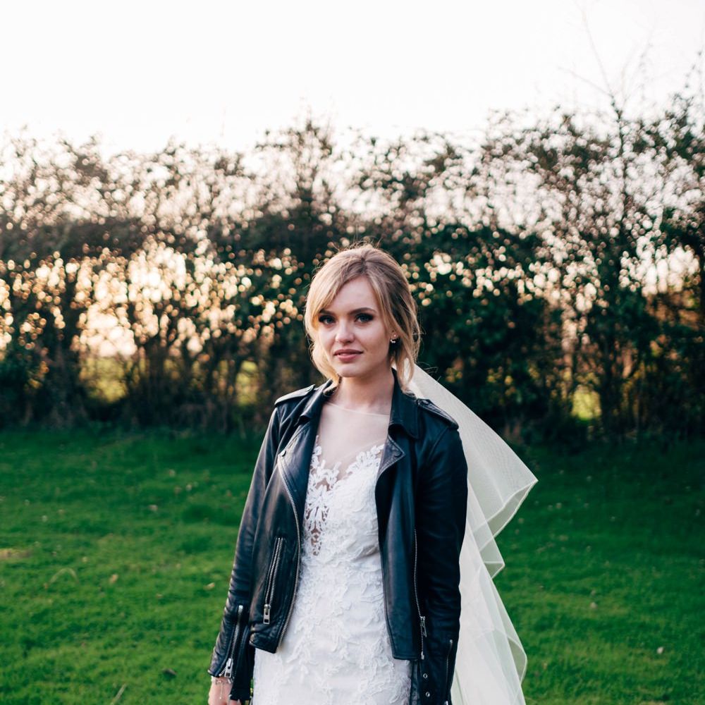 Bride in Lace Illusion Neck Wedding Dress & Leather Jacket | Dale Weeks Photography