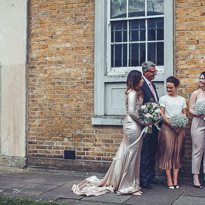 Bride In Gold Sequinned Dress For A Relaxed Wedding At Asylum Chapel With Bridesmaids In Mismatched High Street Dresses And Images by Lovestruck Photography