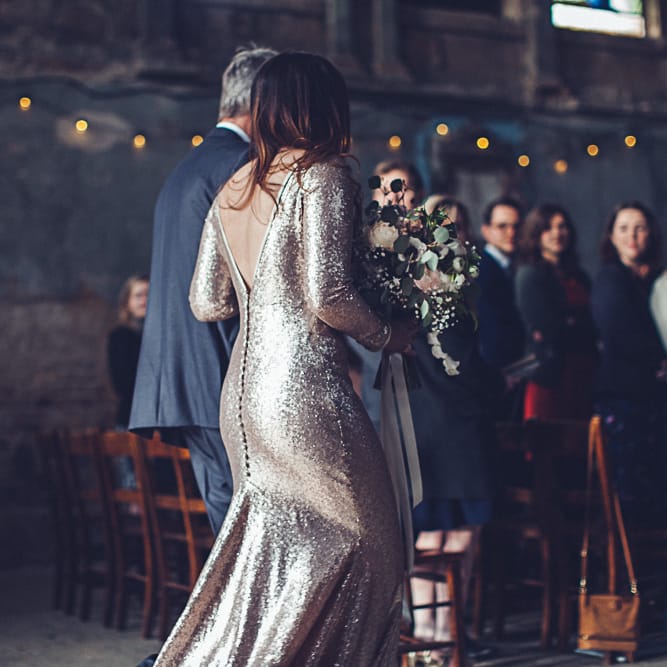 Bride In Gold Sequinned Dress For A Relaxed Wedding At Asylum Chapel With Bridesmaids In Mismatched High Street Dresses And Images by Lovestruck Photography