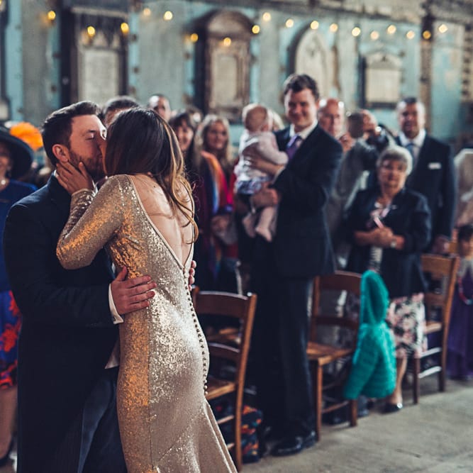 Bride In Gold Sequinned Dress For A Relaxed Wedding At Asylum Chapel With Bridesmaids In Mismatched High Street Dresses And Images by Lovestruck Photography