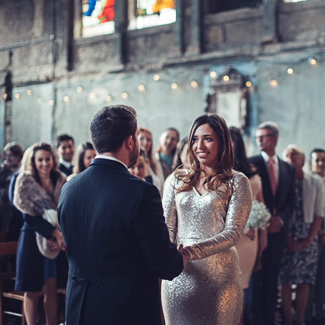 Bride In Gold Sequinned Dress For A Relaxed Wedding At Asylum Chapel With Bridesmaids In Mismatched High Street Dresses And Images by Lovestruck Photography