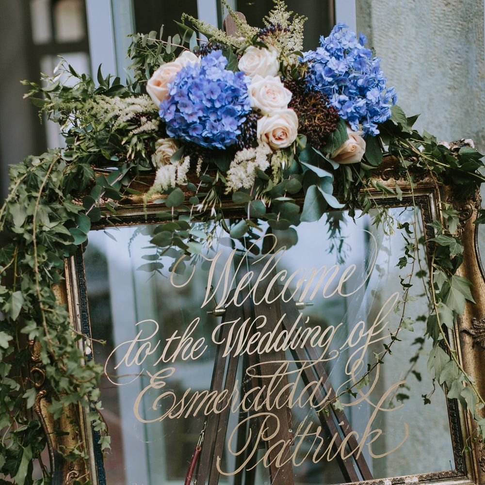 Gold Guilt Mirror Wedding Sign Decorated with Flowers