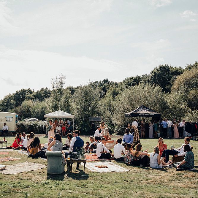 Relaxed Outdoor Reception with Moroccan Rugs | DIY Woodland Wedding at Two Woods Estate in Sussex | PJ Phillips Photography