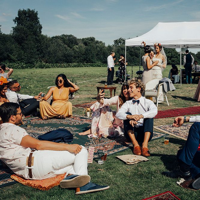 Relaxed Outdoor Reception with Moroccan Rugs | DIY Woodland Wedding at Two Woods Estate in Sussex | PJ Phillips Photography