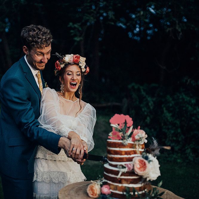 Cutting The Cake | Bride in Bespoke Lace Gown & Flower Grown | Groom in Blue Suit | DIY Woodland Wedding at Two Woods Estate in Sussex | PJ Phillips Photography