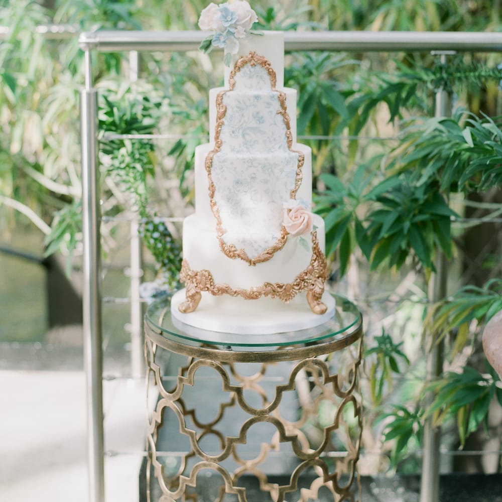 Ornate Wedding Cake With Gold Icing Detail
