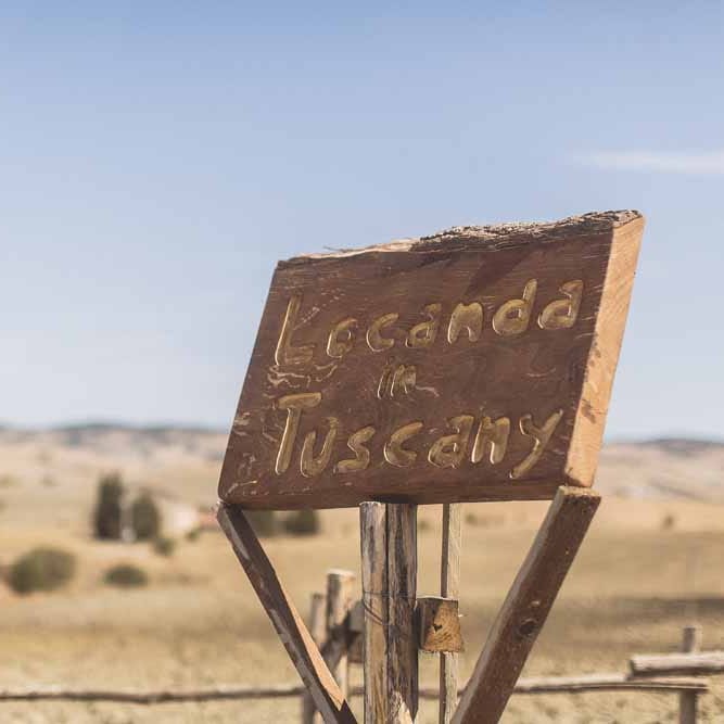 Wooden Welcome Sign For Wedding // Rustic Luxe Wedding In Tuscany Styled By The Wedding Of My Dreams With Flowers By Passion For Flowers Anna Campbell Bride Images & Film From WE ARE // THE CLARKES