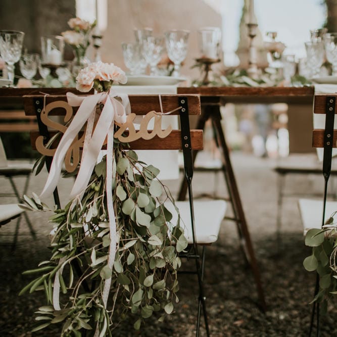 Elegant Chair Back Decor | Tuscan Wedding Planned by Romeo & Juliet Weddings | D&A Photography | Ben Walton Films