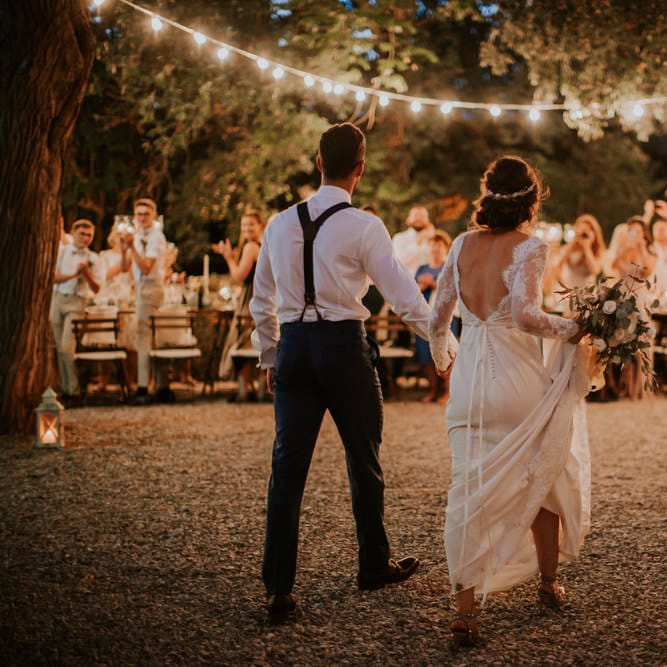 Festoon Lit Outdoor Reception | Bride in Morgan Davies Gown | Groom in Suit Supply | D&A Photography | Ben Walton Films