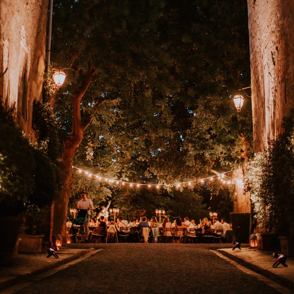 Festoon Lit Outdoor Reception | Bride in Morgan Davies Gown | Groom in Suit Supply | D&A Photography | Ben Walton Films