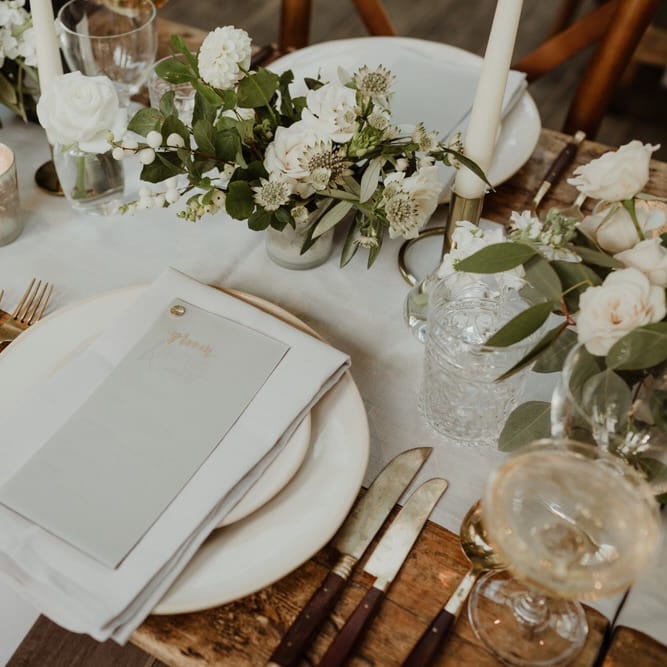 Wooden Trestle Tables With Soft Grey Runners, Taper Candles And White Florals For Wedding Image By The Curries