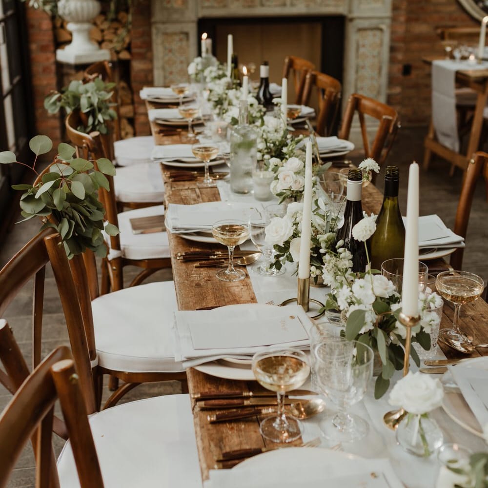 Wooden Trestle Tables With Soft Grey Runners, Taper Candles And White Florals For Wedding Image By The Curries