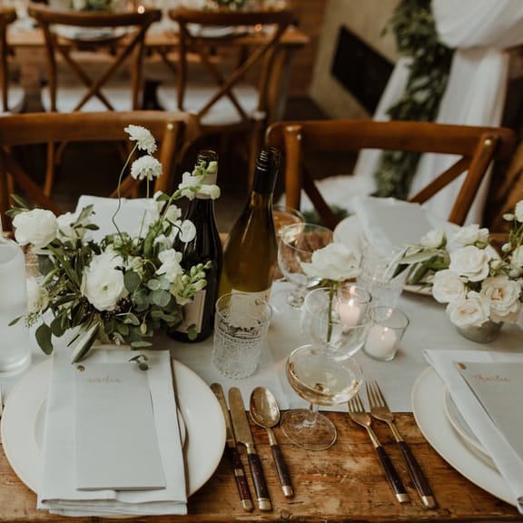 Wooden Trestle Tables With Soft Grey Runners, Taper Candles And White Florals For Wedding Image By The Curries