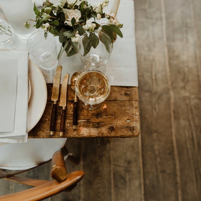 Wooden Trestle Tables With Soft Grey Runners, Taper Candles And White Florals For Wedding Image By The Curries