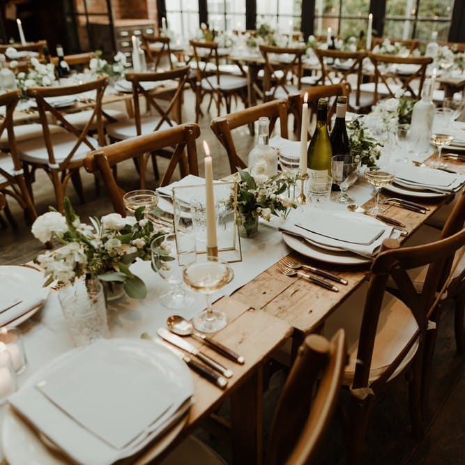 Wooden Trestle Tables With Soft Grey Runners, Taper Candles And White Florals For Wedding Image By The Curries